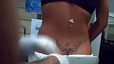 Sexy blonde getting tramp stamp tattoo