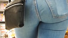 Teen ass in blue jeans very close filmed